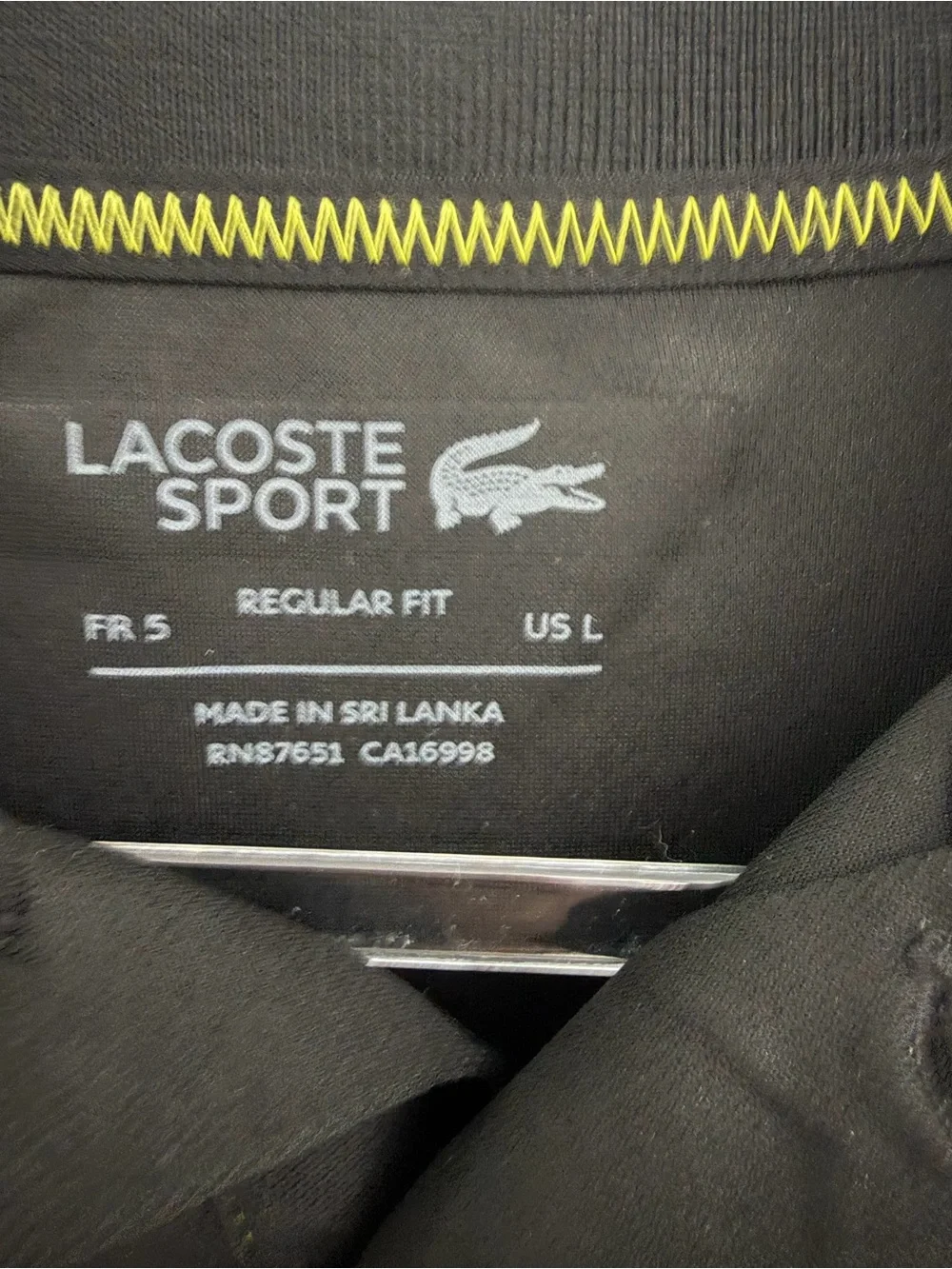 Lacoste Black Polo with Blue Panels and Green Accents
